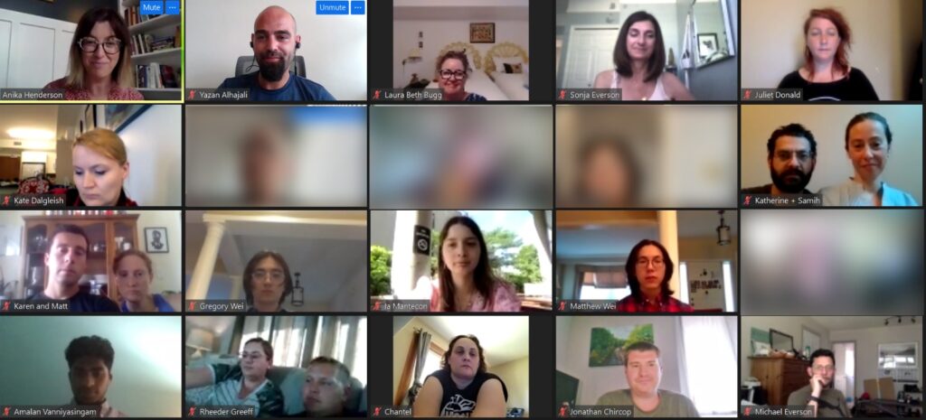 A group of people on a Zoom call. Some are looking straight at the camera and others are looking away. Some blocks are blurred out.
