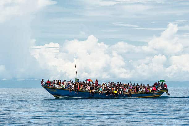 Lake Tanganyika, Tanzania - December 28, 2009: A crowded boat is transporting refugees on Lake Tanganyika from the DR Congo into Tanzania.